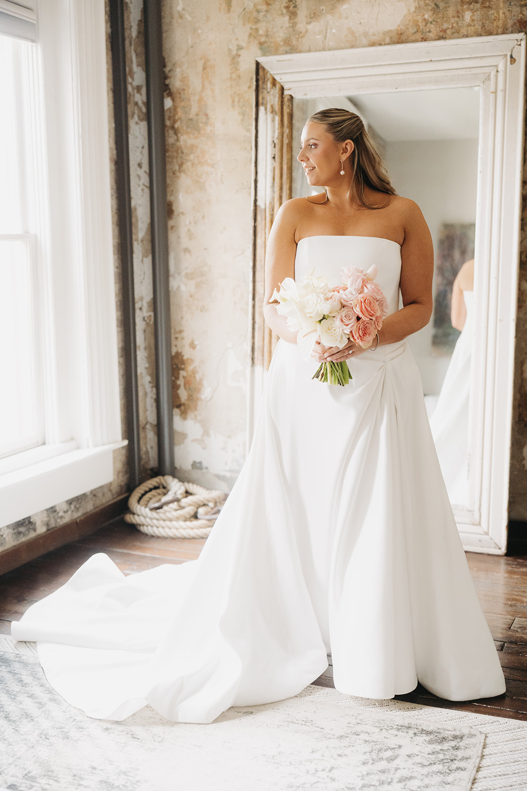 Bride looking out the window in the getting ready room at The Cordelle