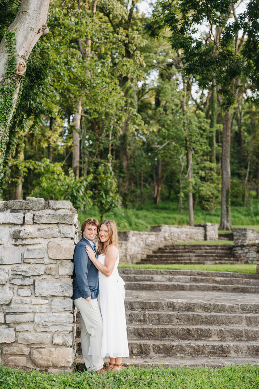 Couple standing in front of the Percy Warner Stairs at their engagement session