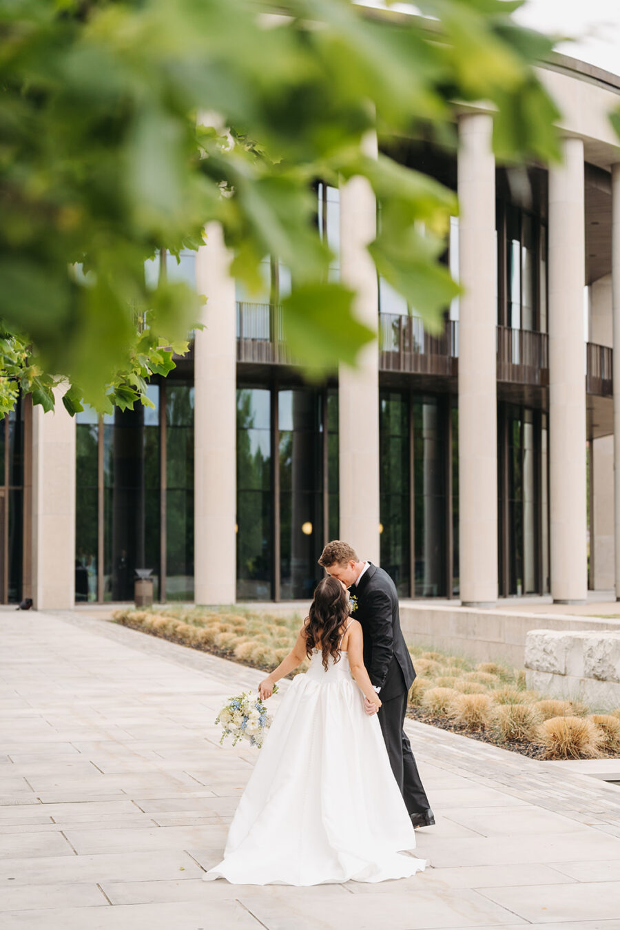 Bride and Groom kissing near the TN State Museum