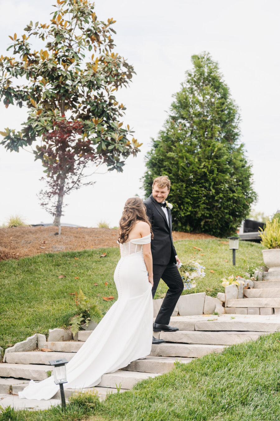 Bride and Groom walking at the stairs at The Venue at Birchwood