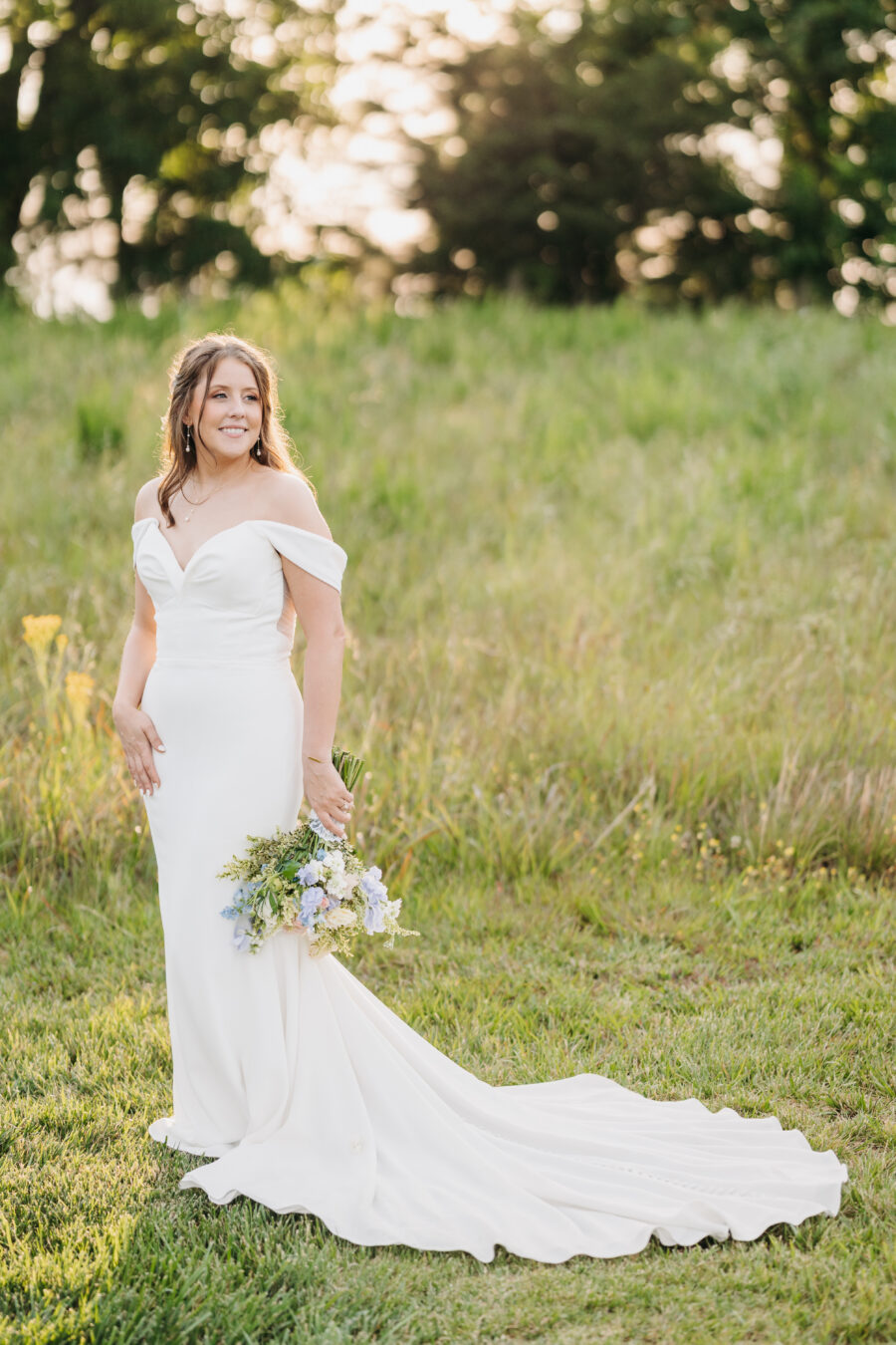 A bride standing in the sun during golden hour at their wedding in Spring Hill, TN